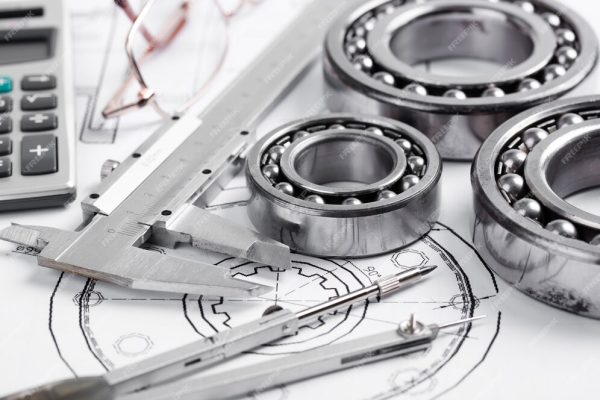 Imatge de dibuixos tecnics, peces i eines de disseny en ing mecanica